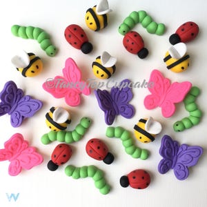 Qty. 12 of the following (bees butterflies ladybugs and inchworms/caterpillars ) handmade fondant cupcake toppers made by FancyTop Cupcake.