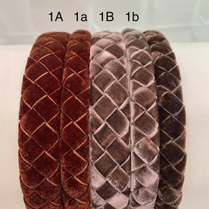 May include: Four velvet headbands in two colors: brown and gray. The headbands are braided and have a diamond pattern. The headbands are labeled 1A, 1a, 1B, and 1b.