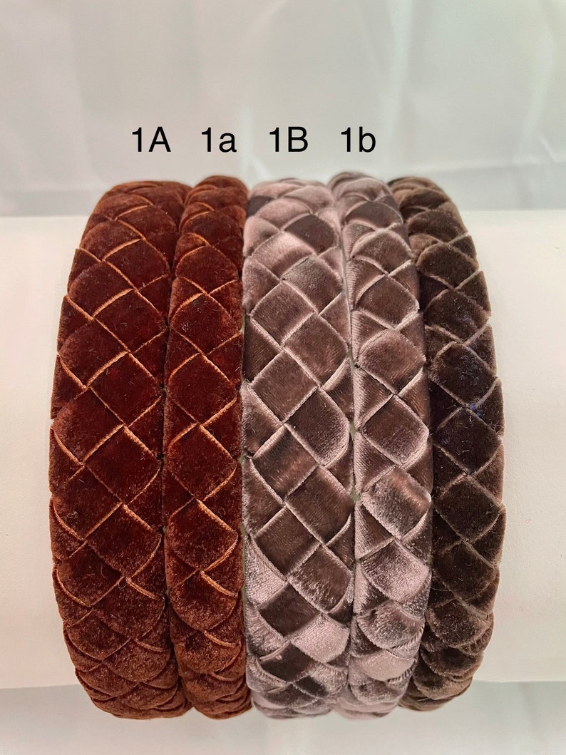 May include: Four velvet headbands in two colors: brown and gray. The headbands are braided and have a diamond pattern. The headbands are labeled 1A, 1a, 1B, and 1b.