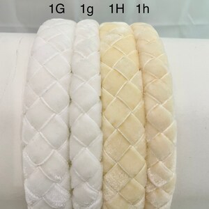 May include: Four velvet headbands in two colors: white and cream. The headbands are braided and have a diamond pattern. The headbands are labeled 1G, 1g, 1H, and 1h.