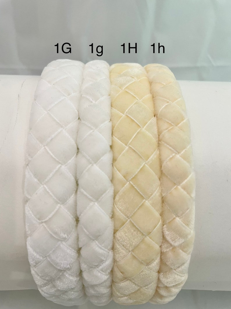 May include: Four velvet headbands in two colors: white and cream. The headbands are braided and have a diamond pattern. The headbands are labeled 1G, 1g, 1H, and 1h.