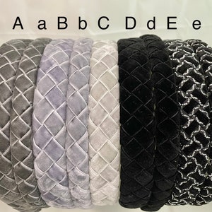 May include: A set of eight headbands in various colors and patterns. The headbands are made of velvet and have a quilted design. The headbands are labeled A, a, B, b, C, D, d, E, and e.