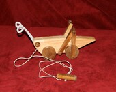 Wooden Happy Grasshopper Toy. Heirloom wooden toy. Pull toy. Movable legs. Handmade. Legs go up and down.