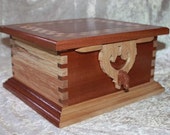 Rohan Jewelry Box with Rohan Horse Latch and Hinges. Two jewelry trays and secret compartments. Exotic Sapele wood and spalted birch.