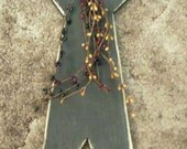 Handmade wooden primitive star wire hanger attached.