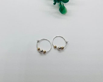 Small mixed metal round hoop earring( 14 k gold/ sterling silver)