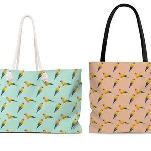 May include: Two tote bags with a parrot pattern. The bag on the left has a light blue background with yellow parrots. The bag on the right has a peach background with yellow parrots.