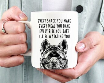 May include: White ceramic mug with a black and white illustration of a dog's head and the text "EVERY SNACK YOU MAKE EVERY MEAL YOU BAKE EVERY BITE YOU TAKE I'LL BE WATCHING YOU"
