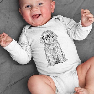 May include: A white long-sleeve baby onesie with a black and white illustration of a dog wearing glasses. The dog is sitting and looking to the right.