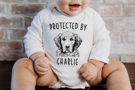 Protected by Dog Baby Bodysuit Protected by a Golden Retriever Baby Clothes Dog Baby Shower Gift Baby Announcement Toddler Kids T Shirt