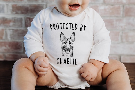 Protected by Dog Baby Bodysuit Protected by a Belgian Malinois Baby Clothes Dog Baby Shower Gift Baby Announcement Toddler Kids T Shirt