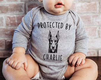 Protected by Dog Baby Bodysuit, Protected by a Doberman Pinscher Baby Clothes, Dog Baby Shower Gift, Baby Announcement, Toddler T Shirt