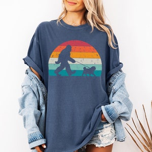 Custom Bigfoot Walking a Dog tshirt with custom dog breed art. This personalized dog shirt is perfect for dog mom, dog dad, dog lovers on Christmas. This is available for dog t-shirt, dog tank top, dog sweatshirt and dog hoodie.