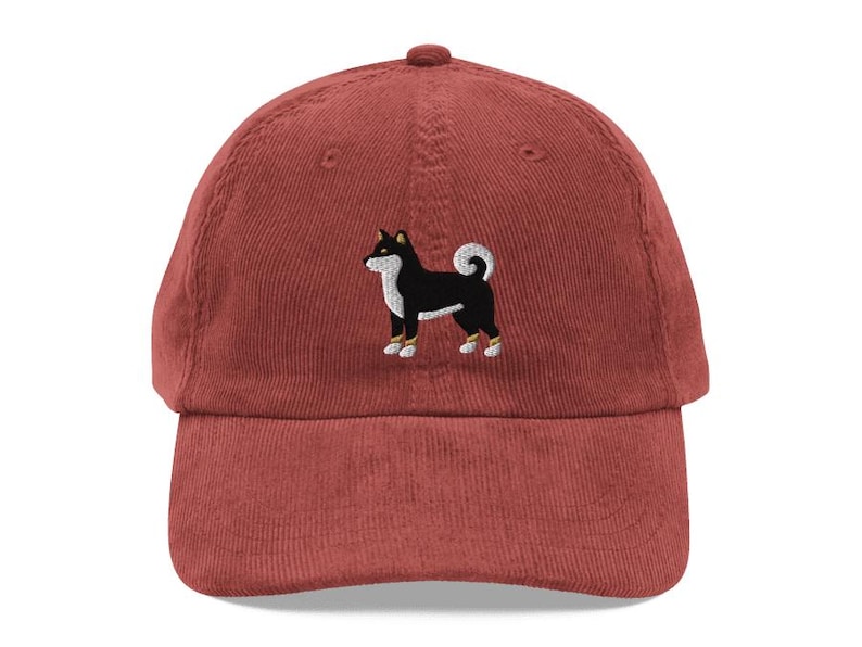 This embroidered Black and Tan Shiba Inu hat is a perfect gift for dog dad, dog mom, Shiba lovers, and dog owner. Whether it's a Shiba Inu beanie, vintage distressed hat, denim hat, corduroy hat or dad hat, it's a cute and funny way to show off your love for your Shiba dog.