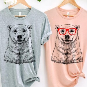 Funny and Cute Nerdy Polar Bear Wearing Glasses shirt for Animal lovers! This Polar Bear art tshirt, tank top, kids tee, youth or sweatshirt is a perfect gift for Polar Bear Lover, and Animal Lovers.