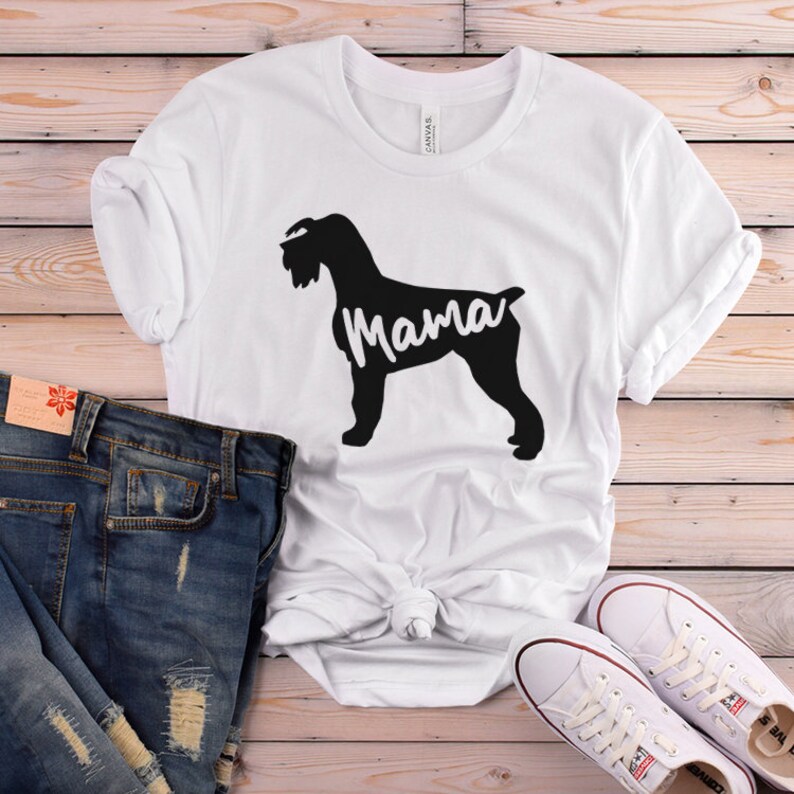 May include: White t-shirt with a black silhouette of a dog and the word "Mama" printed on it.