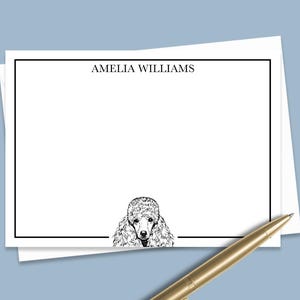 May include: White stationery with a black border and the name "AMELIA WILLIAMS" printed at the top. A black and white illustration of a poodle's head is at the bottom of the stationery.