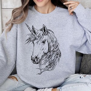 Funny and Cute Nerdy Unicorn Wearing Glasses shirt for Unicorn lovers! This Unicorn art tshirt, tank top, kids tee, youth or sweatshirt is a perfect gift for Unicorn Lover and Animal Lovers.