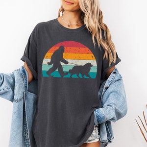 Custom Bigfoot Walking a Dog tshirt with custom dog breed art. This personalized dog shirt is perfect for dog mom, dog dad, dog lovers on Christmas. This is available for dog t-shirt, dog tank top, dog sweatshirt and dog hoodie.