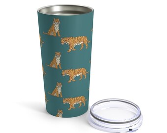 May include: A teal stainless steel tumbler with a repeating pattern of orange tigers. The tumbler has a clear lid.
