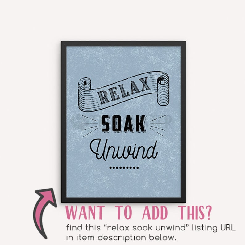 May include: A framed print with a blue background and black text that reads "RELAX SOAK Unwind". The text is in a vintage style font and is surrounded by a decorative scroll.
