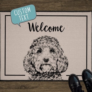 May include: A beige doormat with a black border and a black and white illustration of a poodle. The text "Welcome" is written in black cursive above the poodle. The text "CUSTOM TEXT" is written in a speech bubble in the top left corner.