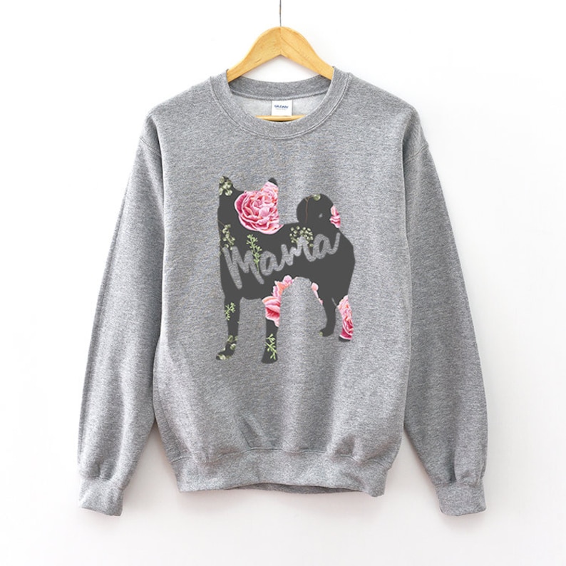 May include: Gray sweatshirt with a floral print of a dog silhouette and the word "Mama" in the center.