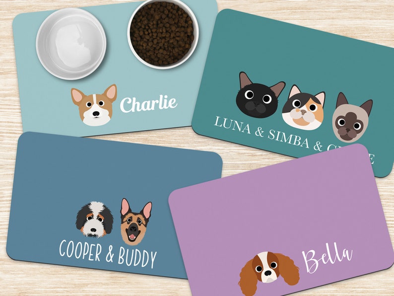 Four colorful personalized pet placemats with two white bowls on one