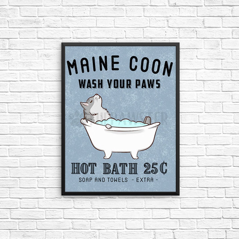 May include: A vintage-style sign with a blue background and black lettering that reads "Maine Coon Wash Your Paws Hot Bath 25&cent; Soap and Towels - Extra -." The sign features a cartoon illustration of a Maine Coon cat taking a bath in a white bathtub.