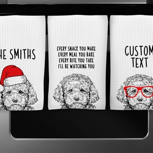 May include: Three white kitchen towels with a black and white illustration of a poodle dog. The first towel has the text "THE SMITHS" and the poodle is wearing a red Santa hat. The second towel has the text "EVERY SNACK YOU MAKE EVERY MEAL YOU BAKE EVERY BITE YOU TAKE I'LL BE WATCHING YOU". The third towel has the text "CUSTOM TEXT" and the poodle is wearing red glasses.