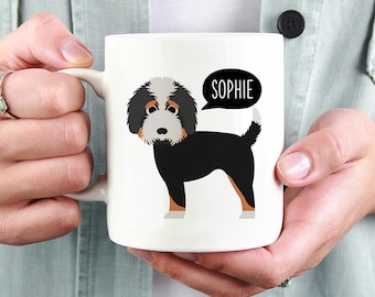 May include: White ceramic mug with a black and white illustration of a dog with the name "Sophie" in a speech bubble.