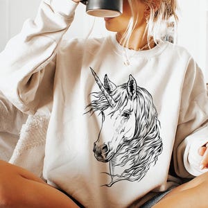 Funny and Cute Nerdy Unicorn Wearing Glasses shirt for Unicorn lovers! This Unicorn art tshirt, tank top, kids tee, youth or sweatshirt is a perfect gift for Unicorn Lover and Animal Lovers.