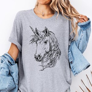Funny and Cute Nerdy Unicorn Wearing Glasses shirt for Unicorn lovers! This Unicorn art tshirt, tank top, kids tee, youth or sweatshirt is a perfect gift for Unicorn Lover and Animal Lovers.