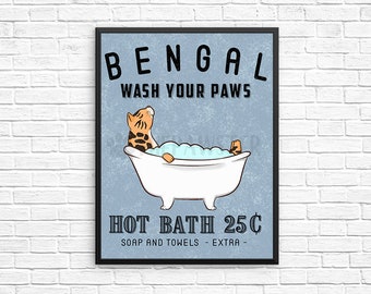 May include: A vintage-style sign with the text "Bengal Wash Your Paws Hot Bath 25¢ Soap and Towels - Extra -" and an illustration of a Bengal cat taking a bath in a white bathtub.