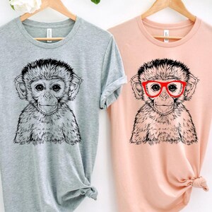 Funny and Cute Nerdy Safari Animal Wearing Glasses shirt for Monkey lovers! This Monkey art tshirt, tank top, kids tee, youth or sweatshirt is a perfect gift for Monkey Lover and Wild Animal Lovers.