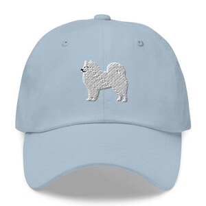 This embroidered Samoyed hat is a perfect gift for dog dad, dog mom, Samoyed lovers, and dog owner. Whether it's a Samoyed beanie, vintage distressed hat, denim hat, corduroy hat or dad hat, it's a cute and funny way to show off your love for your Samoyed dog.