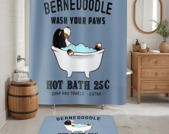 May include: A blue shower curtain with the text "BERNEDOODLE WASH YOUR PAWS HOT BATH 25C SOAP AND TOWELS - EXTRA -" and a cartoon image of a Bernedoodle dog taking a bath. A matching bath mat with the same text and image is shown below the shower curtain.