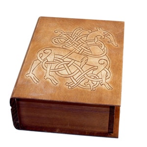 Historical wooden box in the shape of a book with Urnes Dragons