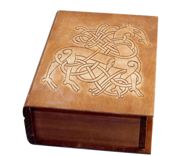 Historical wooden box in the shape of a book with Urnes Dragons