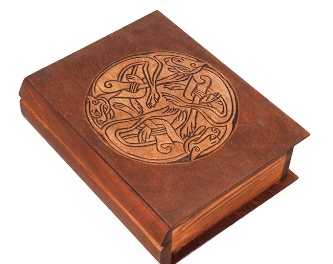 Historical wooden box in the shape of a book with  3 Dogs Book of Kells