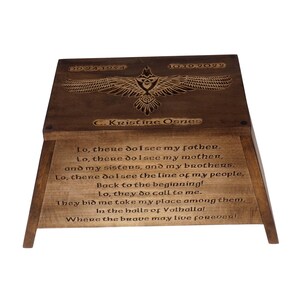 May include: A wooden box with a carved eagle design and the text "Lo, there do I see my father. Lo, there do I see my mother, and my sisters, and my brothers. Lo, there do I see the line of my people, Back to the beginning! Lo, they do call to me. They bid me take my place among them, In the halls of Valhalla! Where the brave may live forever!"