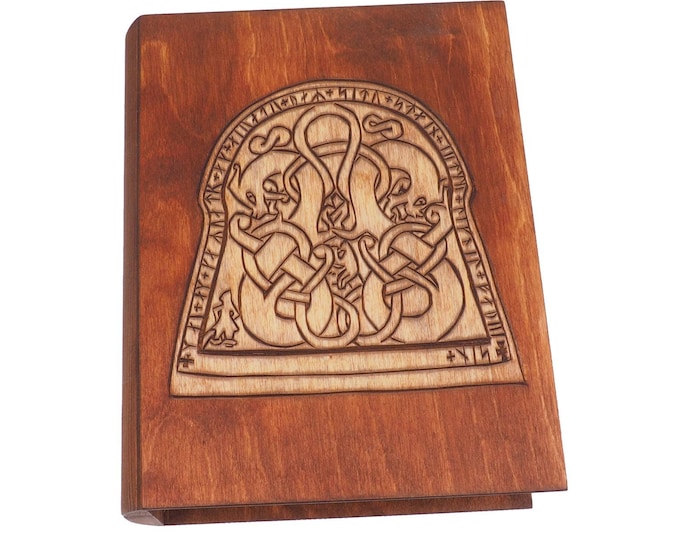 Historical wooden box in the shape of a book with  runestone