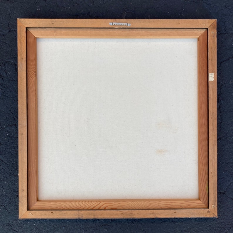 May include: A wooden frame with a white canvas inside. The frame is made of natural wood with a light brown colour. The canvas is stretched tightly over the frame and is ready for painting.