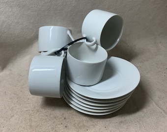 Six White Coffee Cups and Saucers