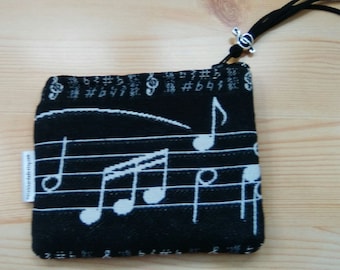 Monedero musica,funda cascos,monedero musico,monedero partitura,estampado musica,tela musica,tela de musica,monedero negro,regalo musico