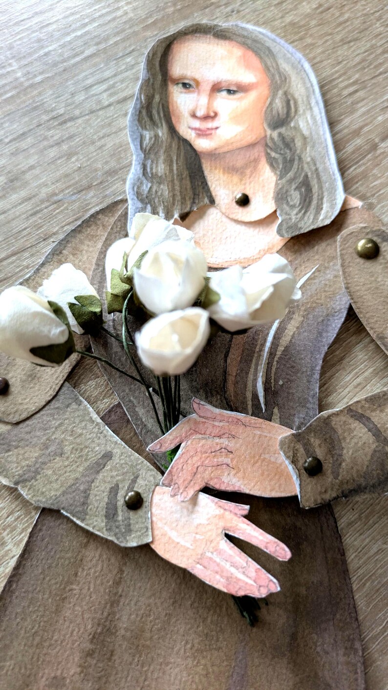 May include: A paper cutout of the Mona Lisa holding a bouquet of white flowers. The artwork is in shades of brown, beige, and cream. The figure's hair is long and wavy, and the hands are delicately posed.
