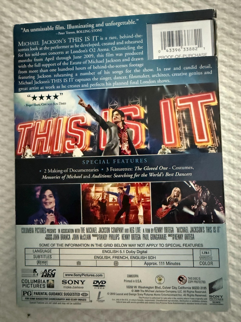 May include: The back cover of the Michael Jackson THIS IS IT DVD features a large image of the performer on stage, text summaries, a barcode, and a list of special features including documentaries and featurettes about costumes and dancers.