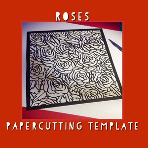 May include: A black papercutting template featuring a rose design. The word "ROSES" is at the top, and "PAPERCUTTING TEMPLATE" is at the bottom. The template is on a white background, framed by a red border.
