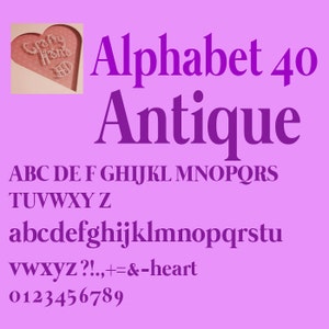 May include: A purple font chart with the text "Alphabet 40 Antique" and the letters of the alphabet in uppercase and lowercase, numbers, and punctuation marks.