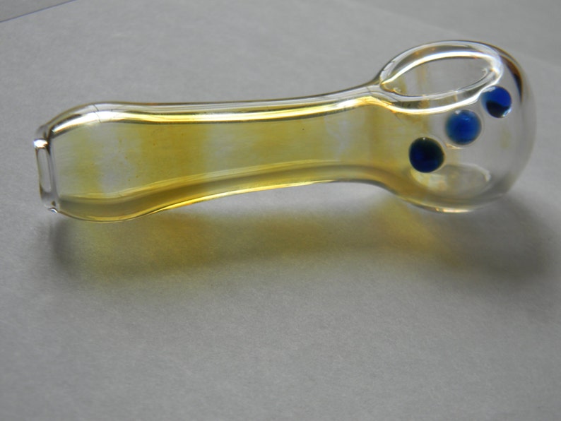 Spoon shaped with Green Amber Red or Blue grip dots comes with a free onnie. Hand Blown Fumed Glass Pipe